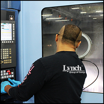 Man using machine and looking through window